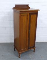 Edwardian mahogany ledgeback music cabinet, 51 x 124 x 38cm.