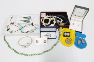 A collection of silver and costume jewellery to include necklaces, earrings and brooches, etc (a