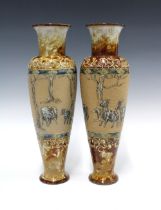 HANNAH BARLOW for Doulton Lambeth, a pair of 'goats' sgraffito decorated vases of elongated tapering