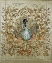 Late 19th / early 20th century silk embroidery depicting a peacock within flowers and foliage,