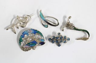 OLA M.GORIE silver and enamel brooch together with three other silver and enamel brooches, two