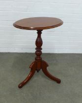 Mahogany pedestal table, the oval top on a baluster column and tripod legs, 62 x 74 x 44cm.