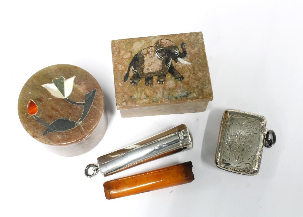 An Edwardian silver cheroot case, Birmingham 1908 , containing an amber cheroot together with an