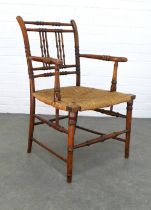 Arts & Crafts country wood open armchair with a woven rush seat, 57 x 86 x 46cm.