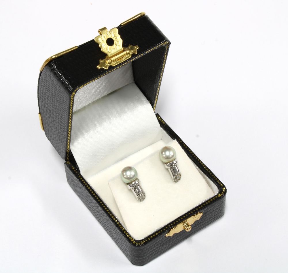 A pair of 18ct white gold diamond and pearl earrings