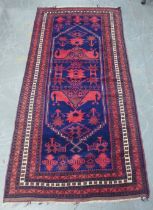 Persian runner, blue and red field, 117 x 250cm.