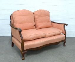 Walnut framed two seater settee, with salmon pink damask upholstery, serpentine back with sea