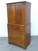Mahogany tall boy cabinet, the cornice top above a pair of cupboard doors that open to reveal a