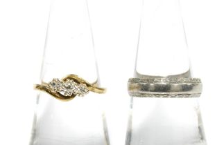 9ct white gold wedding band, London 1982 and a 9ct gold diamond three stone ring (2)