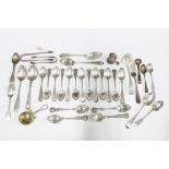 A collection of silver teaspoons, sugar tongs, forks, etc, with various silver hallmarks and