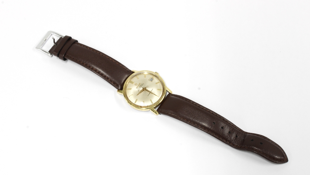 OMEGA AUTOMATIC CHRONOMETER CONSTELLATION, Gents gold plated calendar wristwatch on a brown