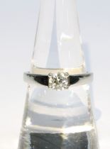 Diamond solitaire ring, the 0.5ct round brilliant cut diamond is set in a four claw platinum