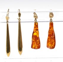 A pair of 9ct gold drop earrings and a pair of amber and gold mounted drop earrings (2)