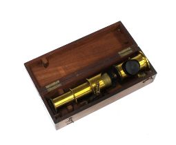 Mahogany cased monocular brass microscope, 21 x 7cm.