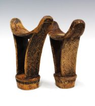 Two West African wooden neck rests with incised woven pattern (2) 20 x 17cm.