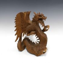 Fruitwood carving of a Dragon, 35 x 33cm.