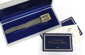 Christian Dior gold plated wristwatch, signed tank dial, on a grey leather strap, complete with