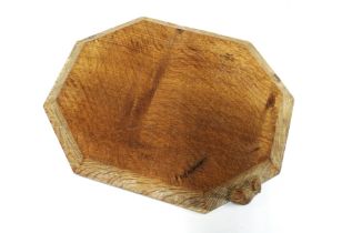 Workshop of Robert Mouseman Thompson oak bread board, octagonal form with carved mouse signature,