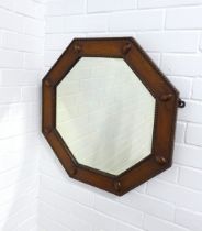 An early 20th century octagonal oak wall mirror, 61 x 61cm.