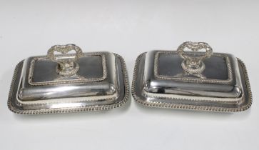A pair of Epns entree dishes and covers (2) 28 x 20cm.