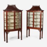 A pair of Chinese Chippendale style carved mahogany and glass display cabinets 20th century