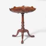A George III carved mahogany tilt-top candlestand circa 1760