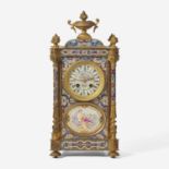 A French cloisonné enamel and gilt-bronze mounted mantel clock with painted porcelain set