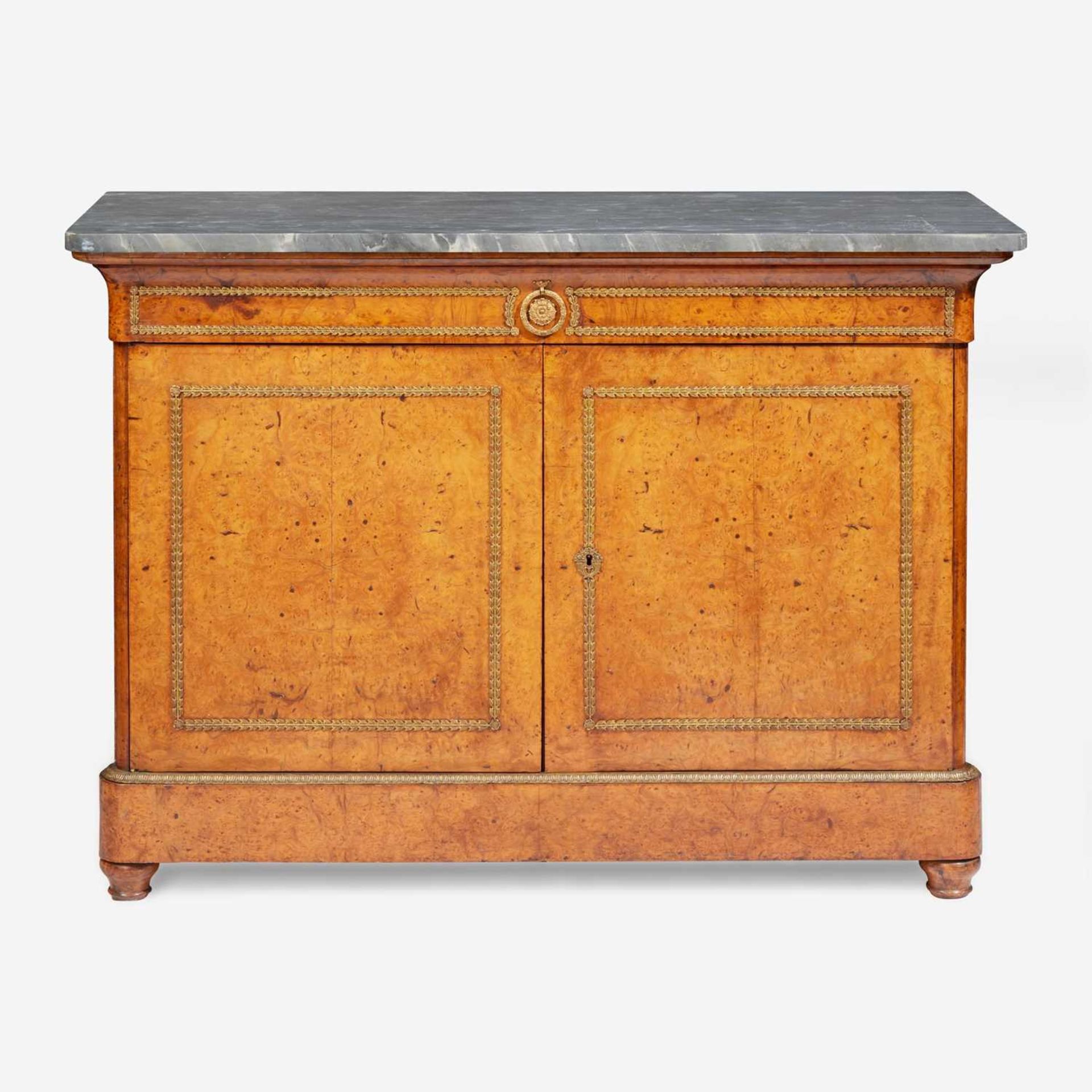 A Charles X gilt bronze-mounted pollard oak side cabinet with Saint Anne marble top circa 1820