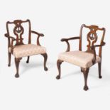 A pair of George II carved walnut armchairs circa 1730