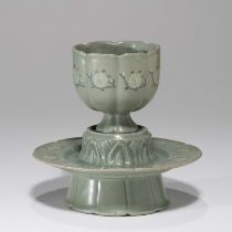 A SET OF KOREAN CELADON 'CHRYSANTHEMUM' LOBED CUP AND STAND, GORYEO DYNASTY