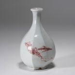 A KOREAN UNDERGLAZE-RED 'LEAVES' FACETED JAR, JOSEON DYNASTY