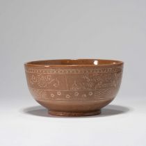 A KOREAN YELLOW GLAZED 'LANDSCAPE AND FLOWER' BOWL, GORYEO DYNASTY