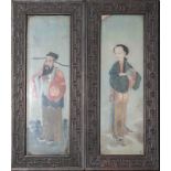 A PAIR OF WOOD FRAMED GLASS PAINTINGS