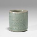 A KOREAN CELADON 'LOTUS' TEA CUP, GORYEO DYNASTY