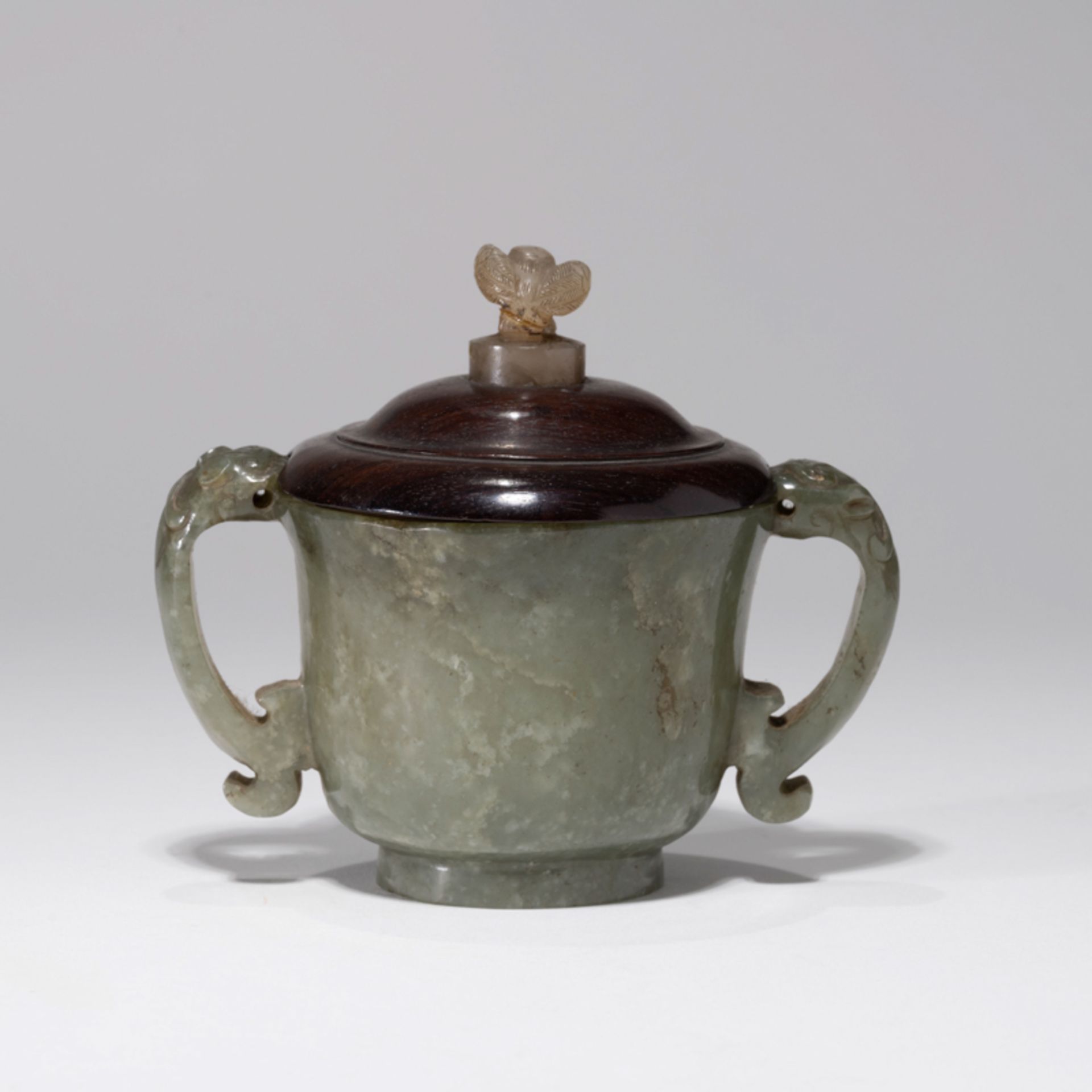 A CHINESE GREEN JADE BEAST-HANDLED CENSER