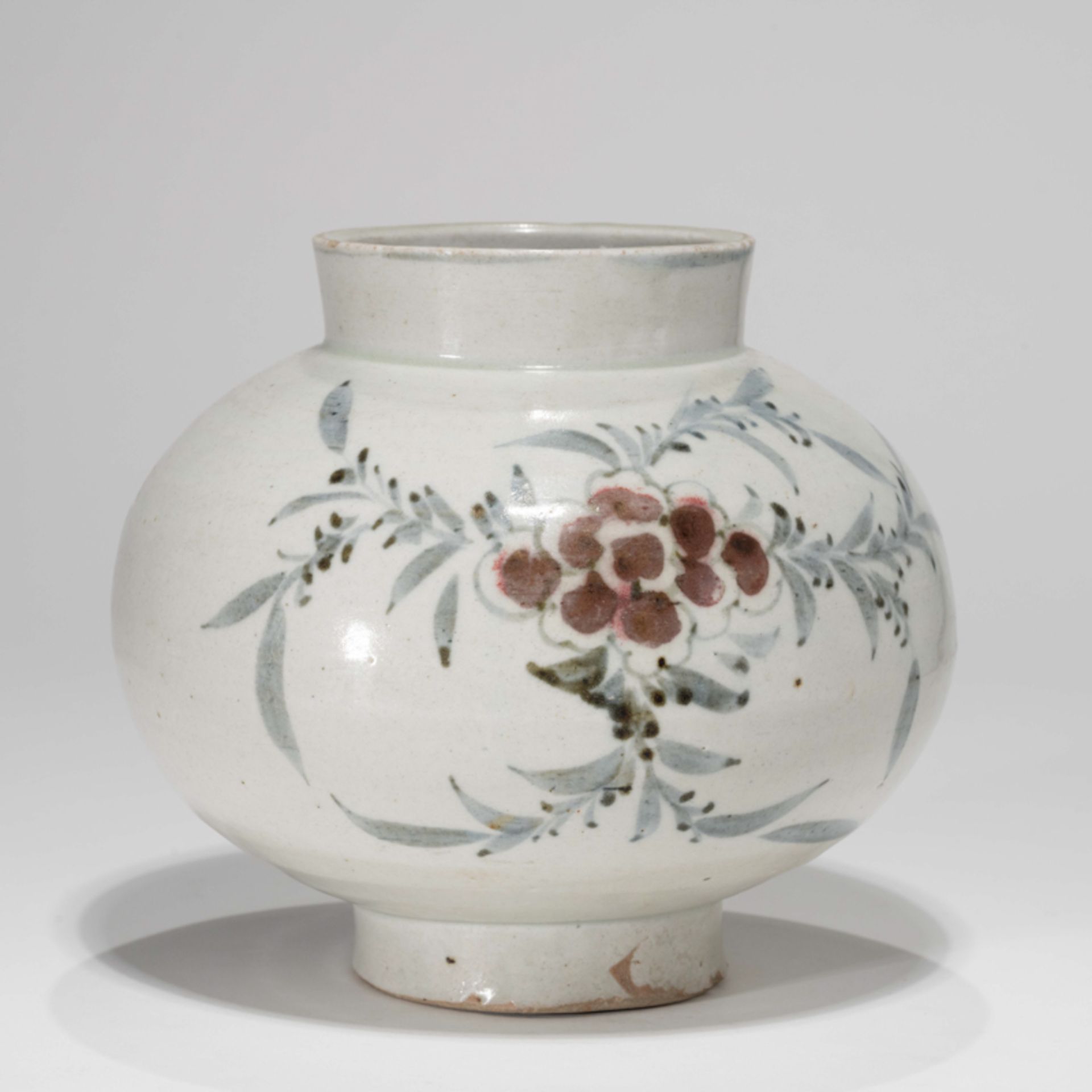 A KOREAN BLUE AND WHITE POT WITH UNDERGLAZE-RED PAINTED PEONY DESIGN