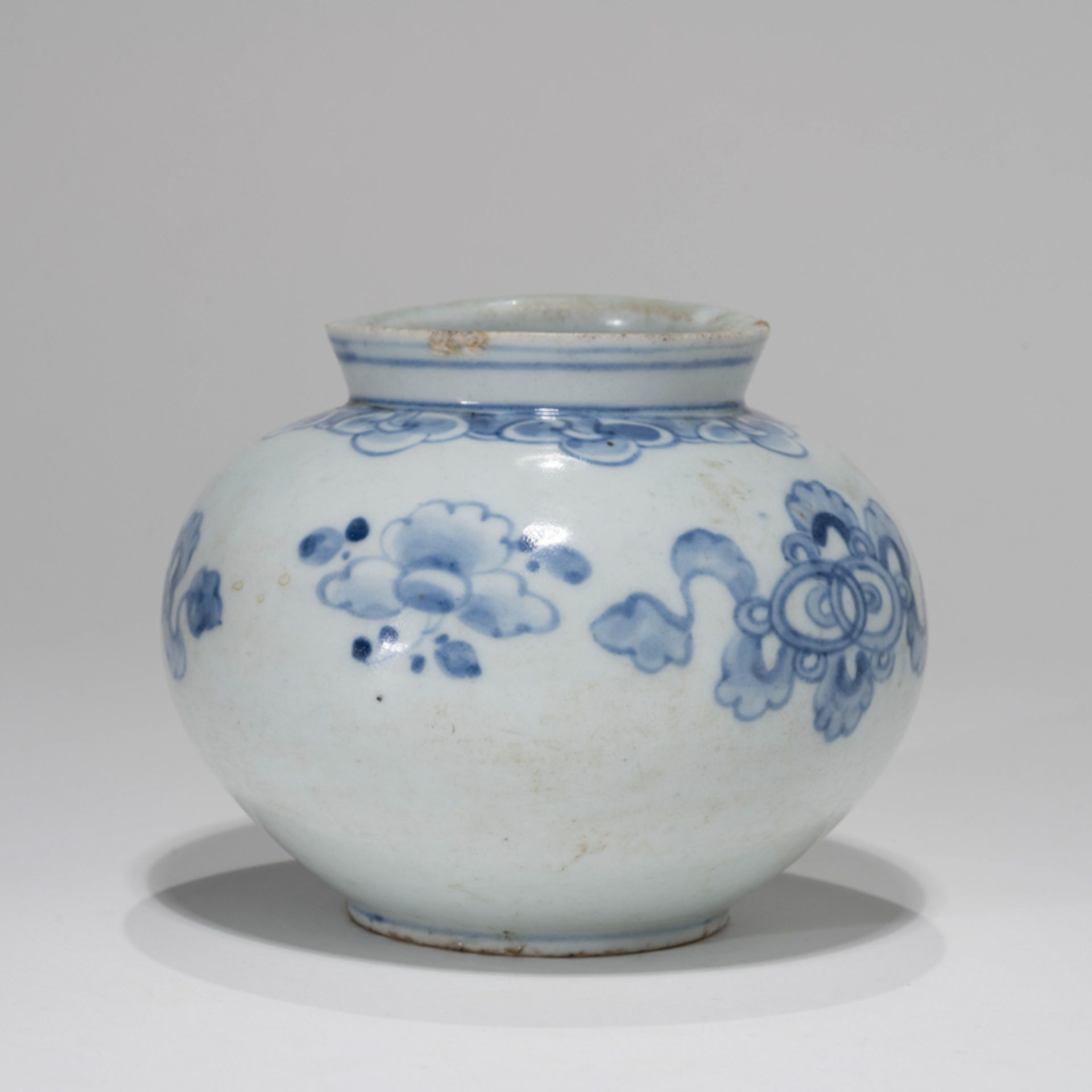 A KOREAN BLUE AND WHITE ‘AUSPICIOUS SYMBOLS AND FLOWERS’ ROUND POT, JOSEON DYNASTY