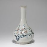 A KOREAN UNDERGLAZE-RED PAINTED BLUE AND WHITE 'FLOWER AND BAMBOO' BOTTLE VASE , JOSEON DYNASTY