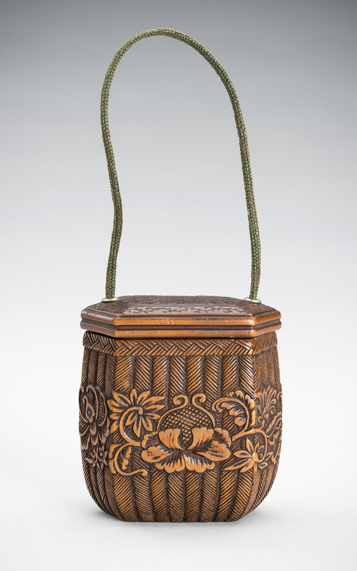 A MINIATURE BOXWOOD TONKOTSU IN SHAPE OF A WOVEN BASKET, EDO