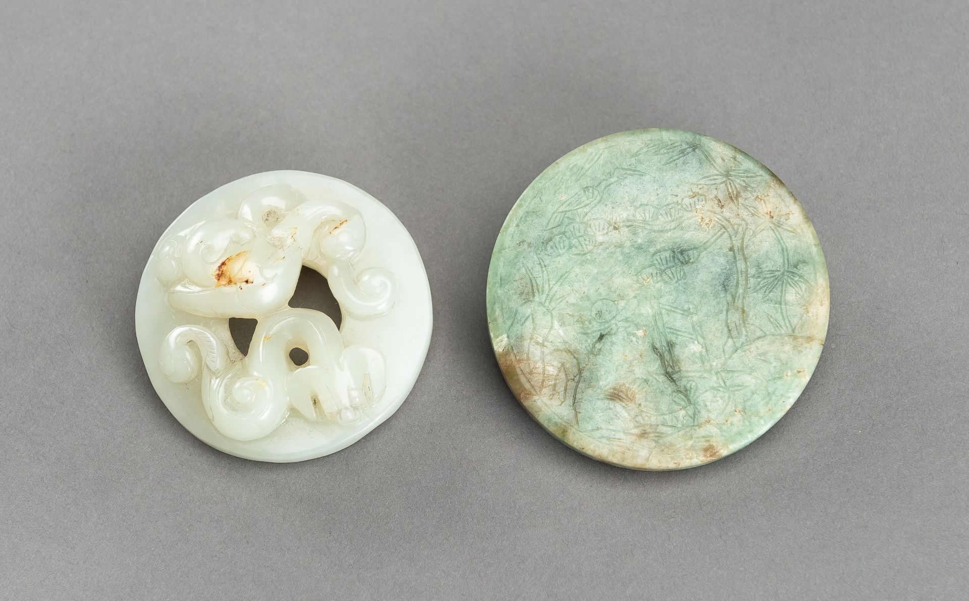 A LOT WITH TWO DECORATIVE JADE & HARDSTONE DISCS