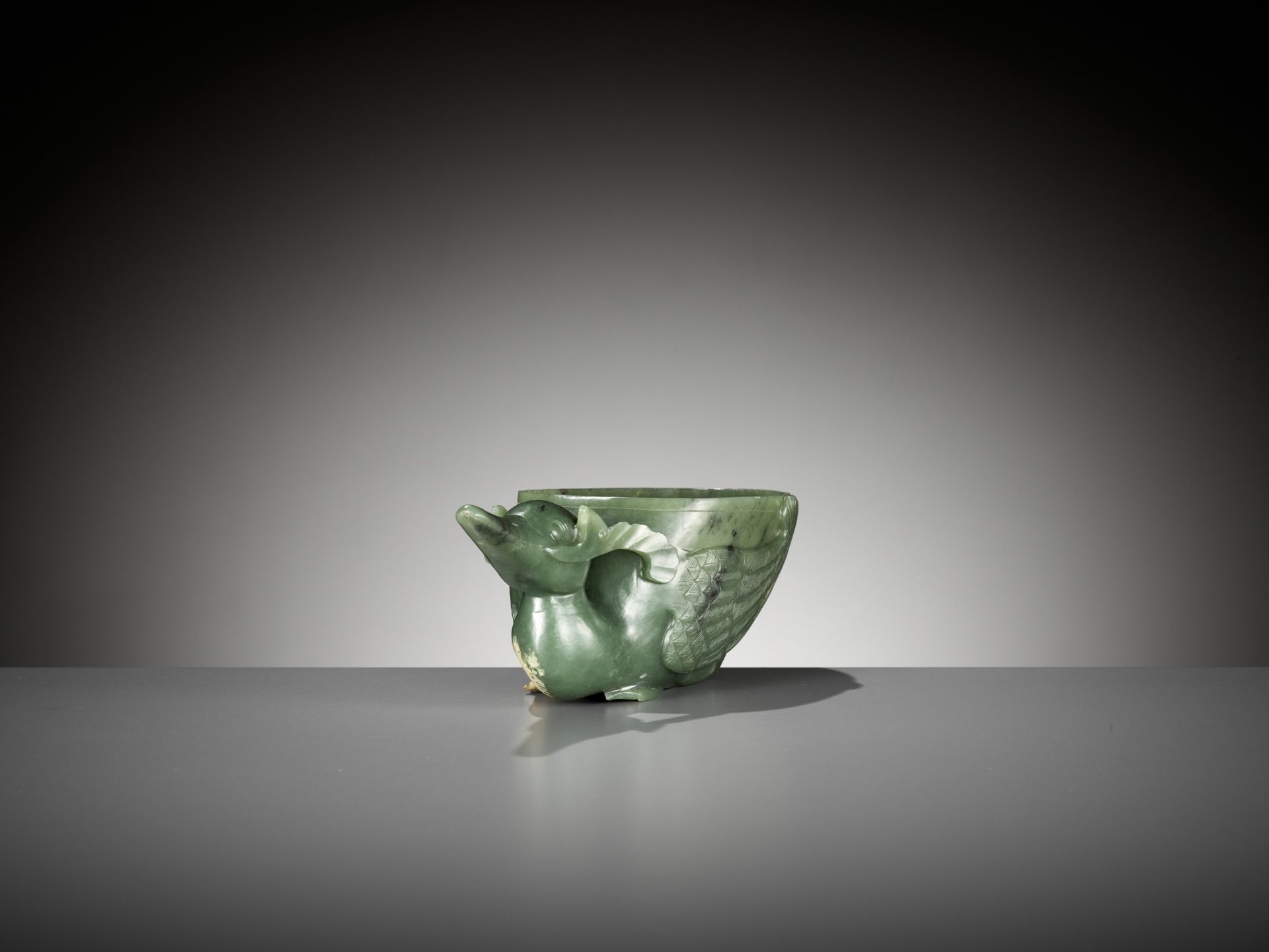 A SPINACH GREEN JADE 'DUCK' LIBATION CUP, QING DYNASTY - Image 7 of 9