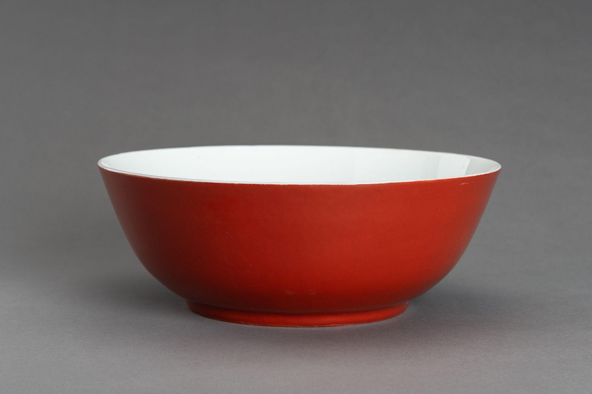 A LARGE COPPER-RED GLAZED PORCELAIN BOWL