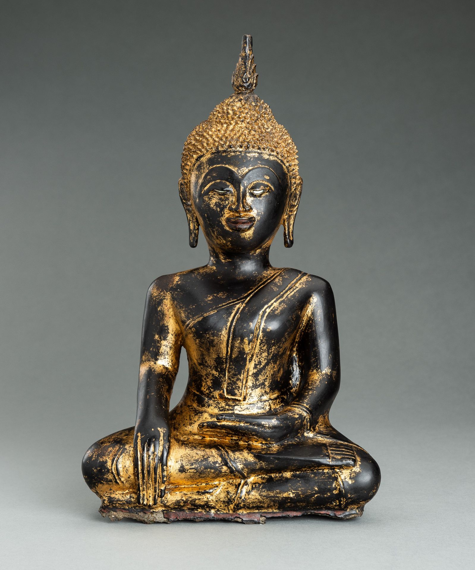 A GOLD LACQUERED BRONZE FIGURE OF BUDDHA