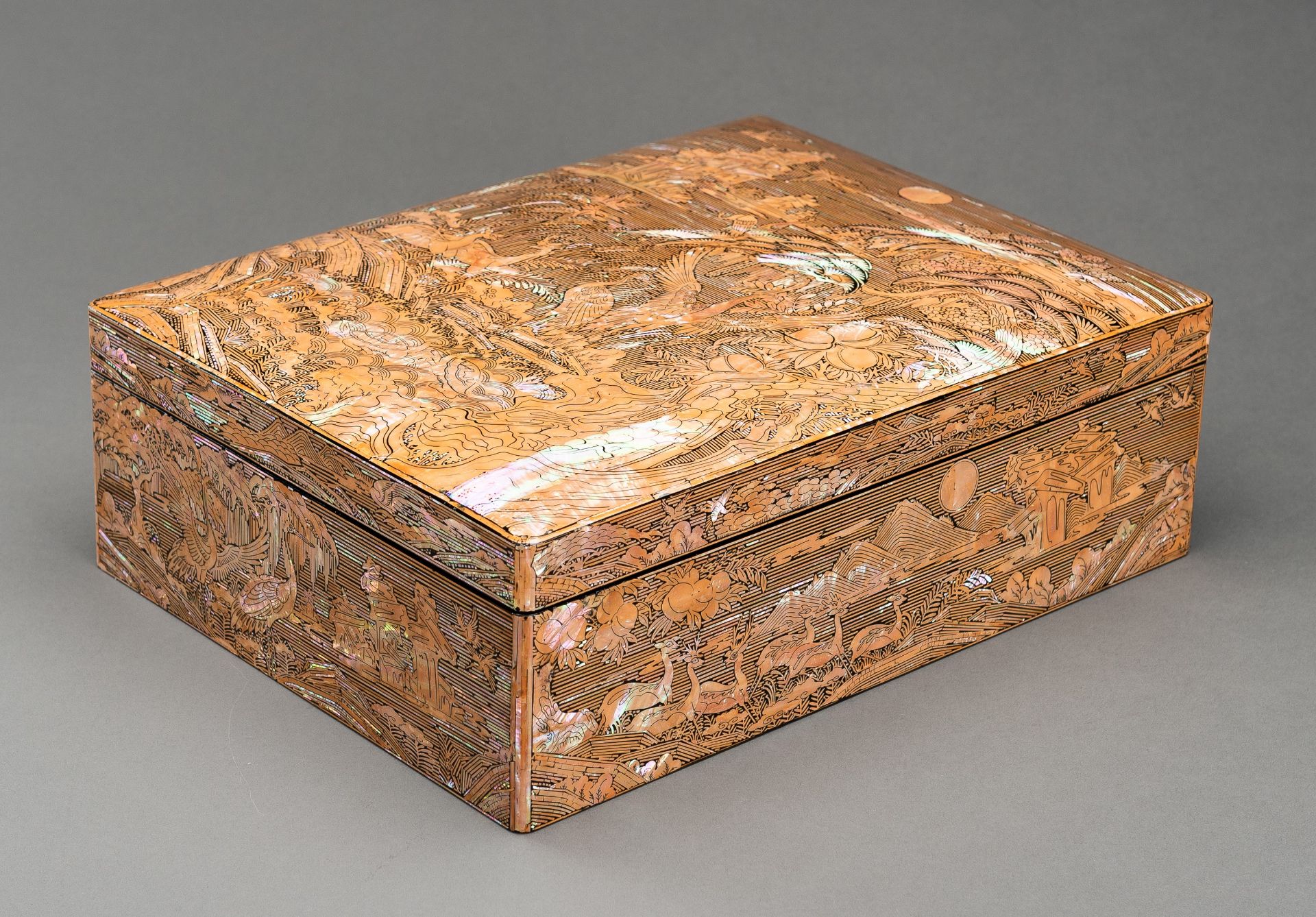 A MOTHER-OF-PEARL INLAID WOOD BOX AND COVER