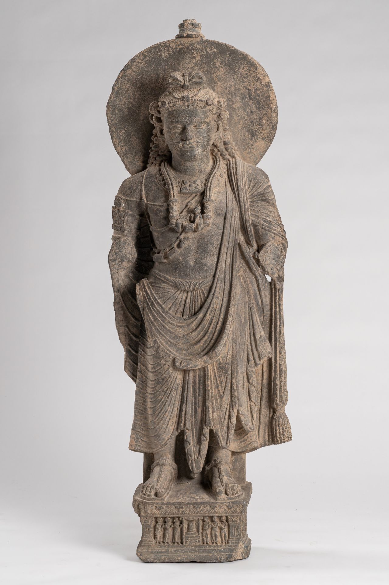 A GANDHARA-STYLE GRAY SCHIST FIGURE OF MAITREYA