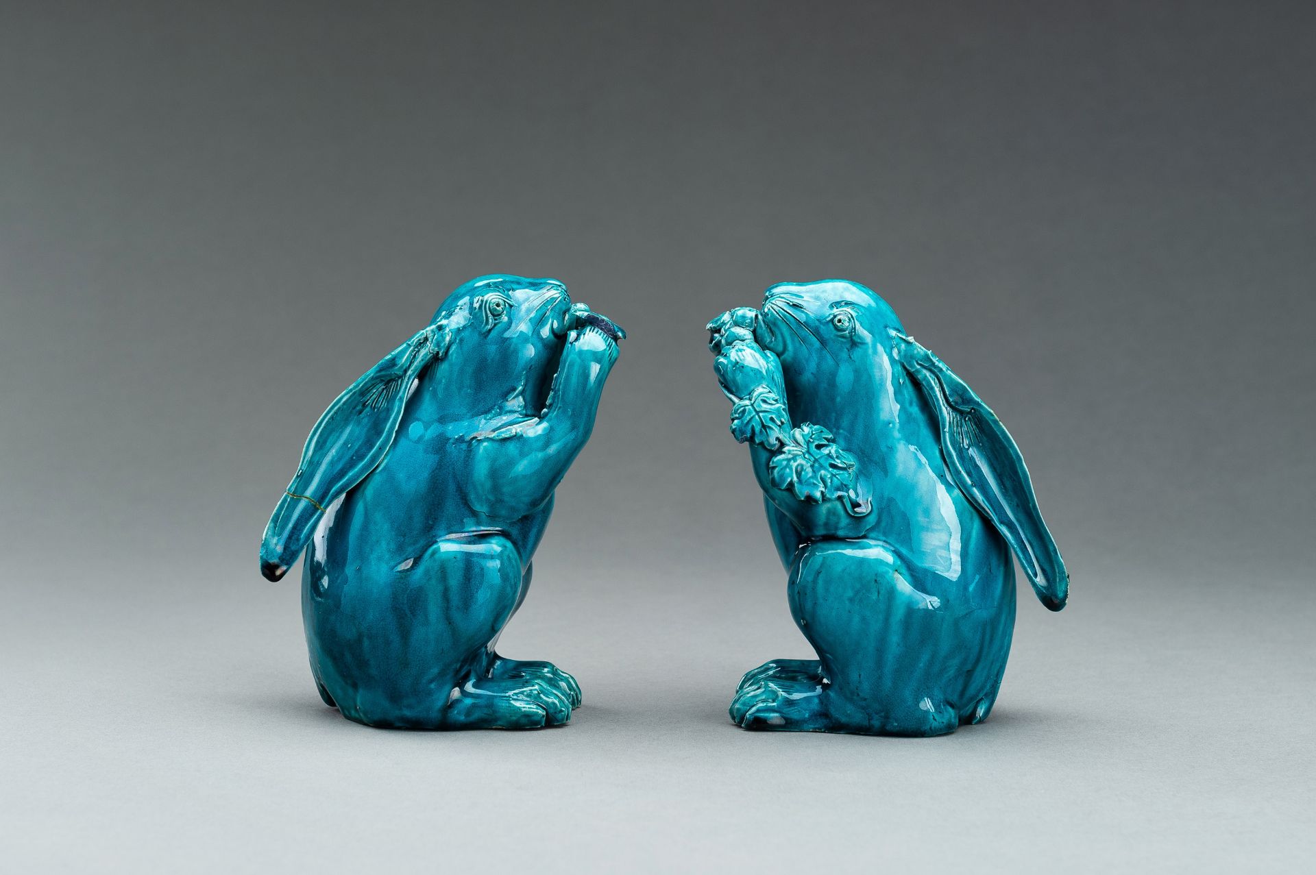 A PAIR OF TURQUOISE GLAZED CERAMIC FIGURES OF RABBITS EATING BERRIES - Image 2 of 10