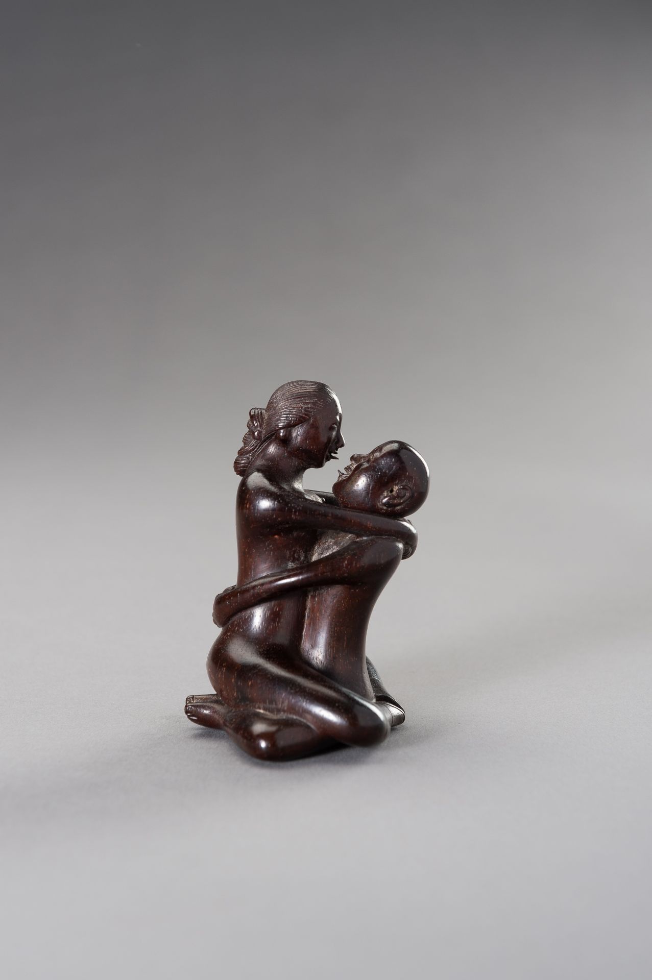 A ZITAN WOOD FIGURE OF A COUPLE IN EROTIC EMBRACE - Image 3 of 12