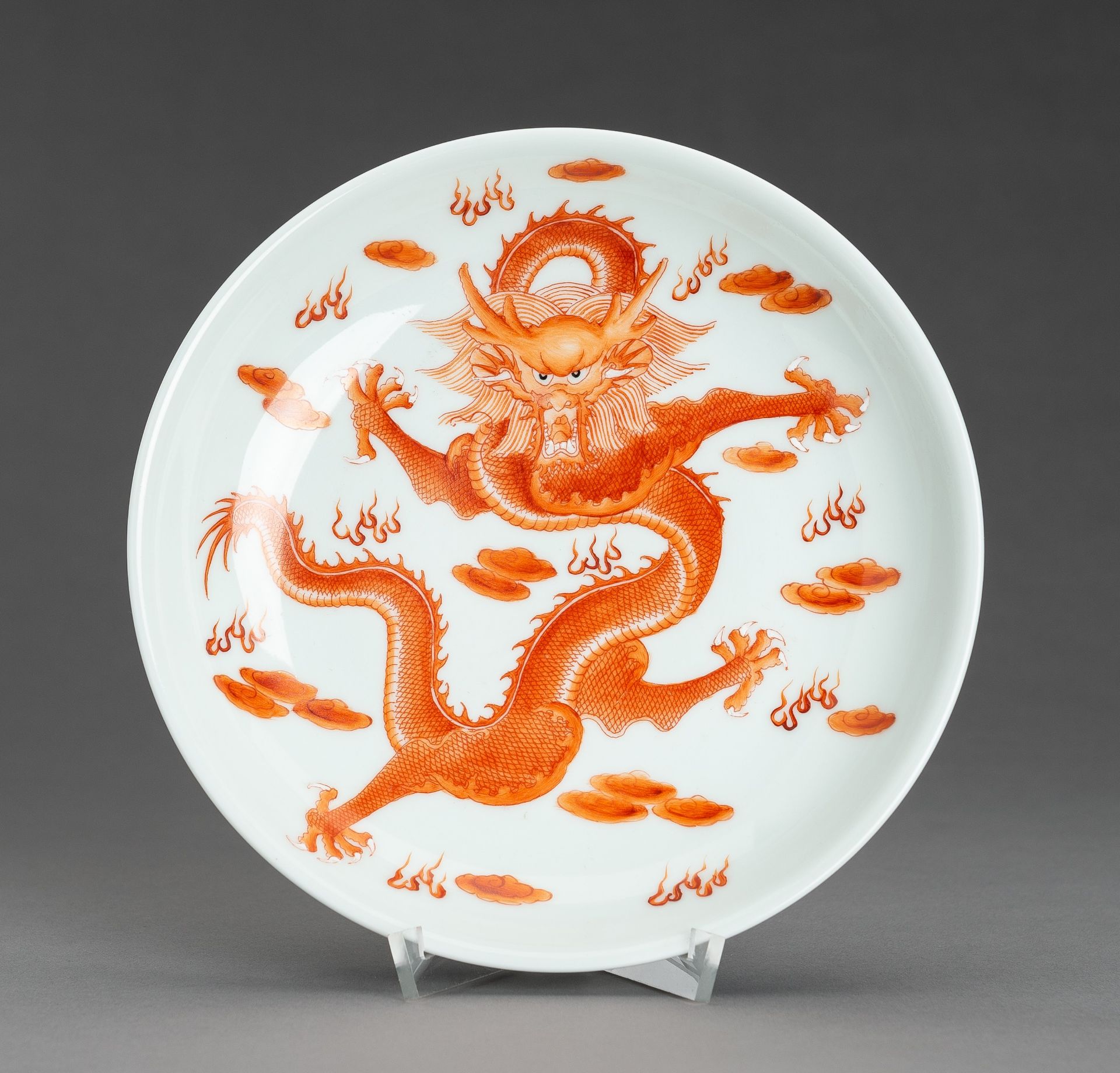 AN IRON-RED 'DRAGON AND BATS' PORCELAIN DISH