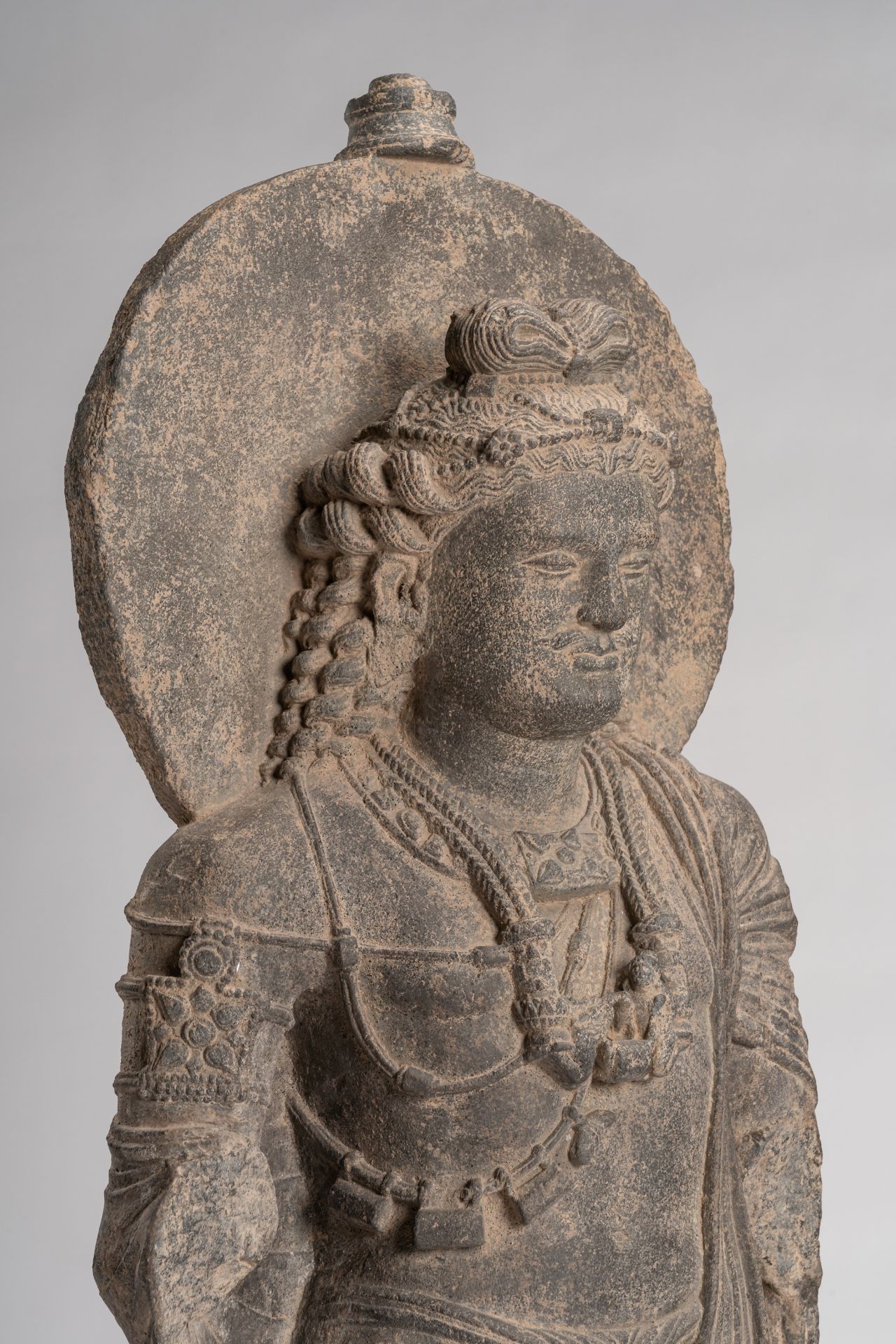 A GANDHARA-STYLE GRAY SCHIST FIGURE OF MAITREYA - Image 2 of 8