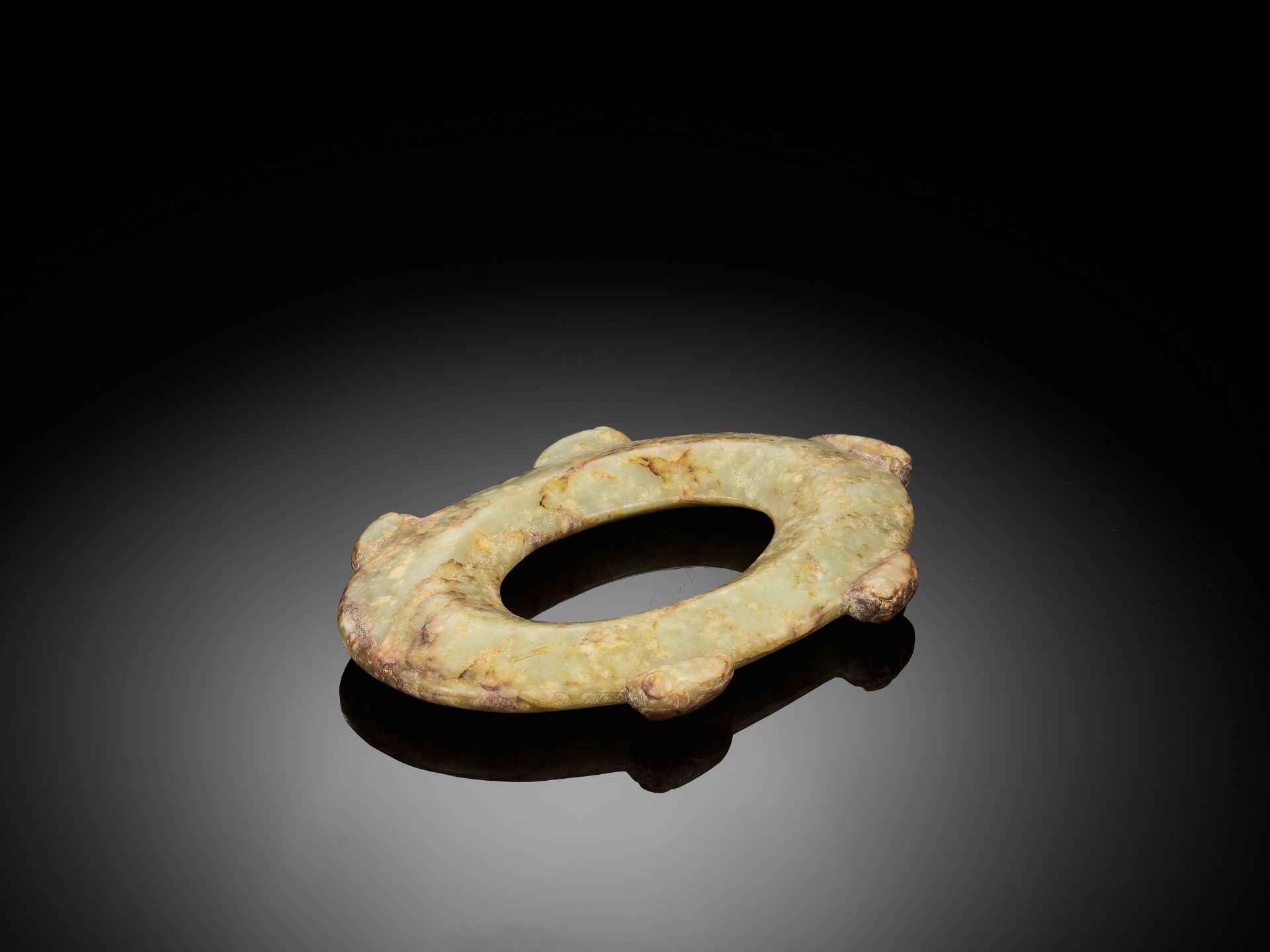 AN ARCHAISTIC PALE CELADON OVAL JADE DISC - Image 2 of 5